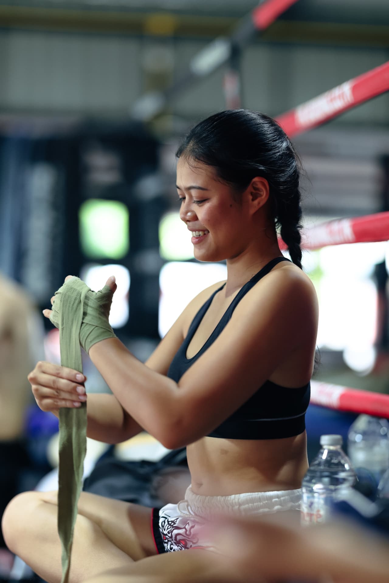 A student wrapping her hands before training